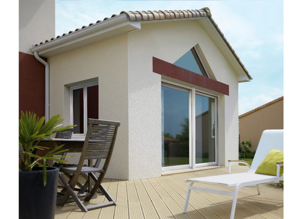 Baie coulissante vitrée d'une petite maisonnette vue depuis la terrasse